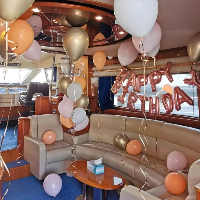 Birthday decorations with balloons inside yacht cabin