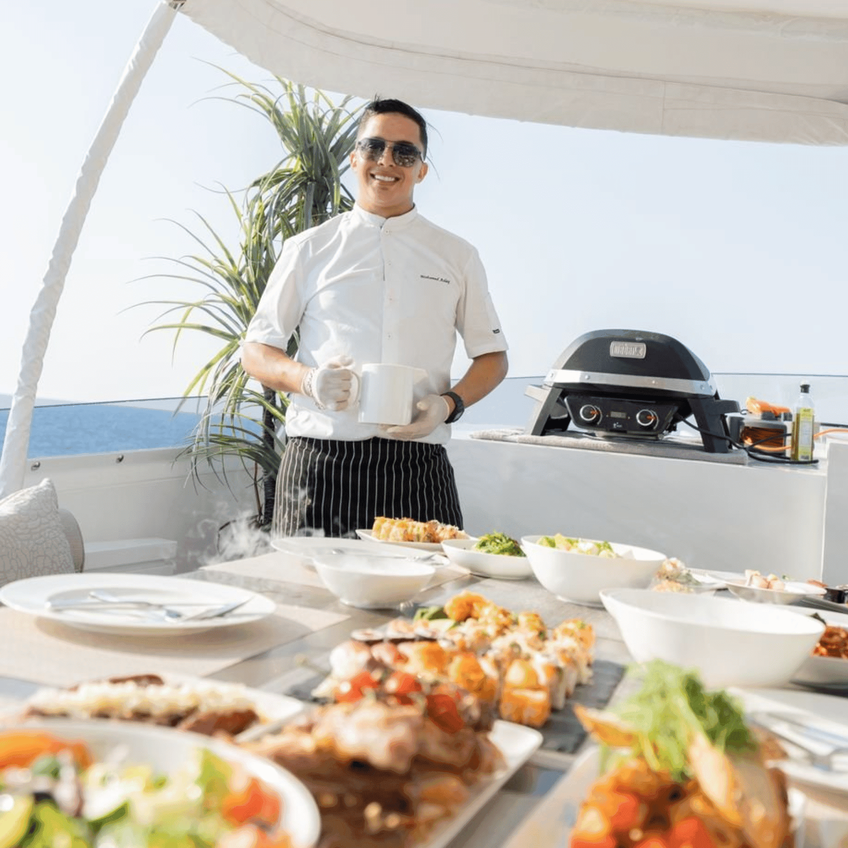 Private chef cooking gourmet meal on a yacht in Miami