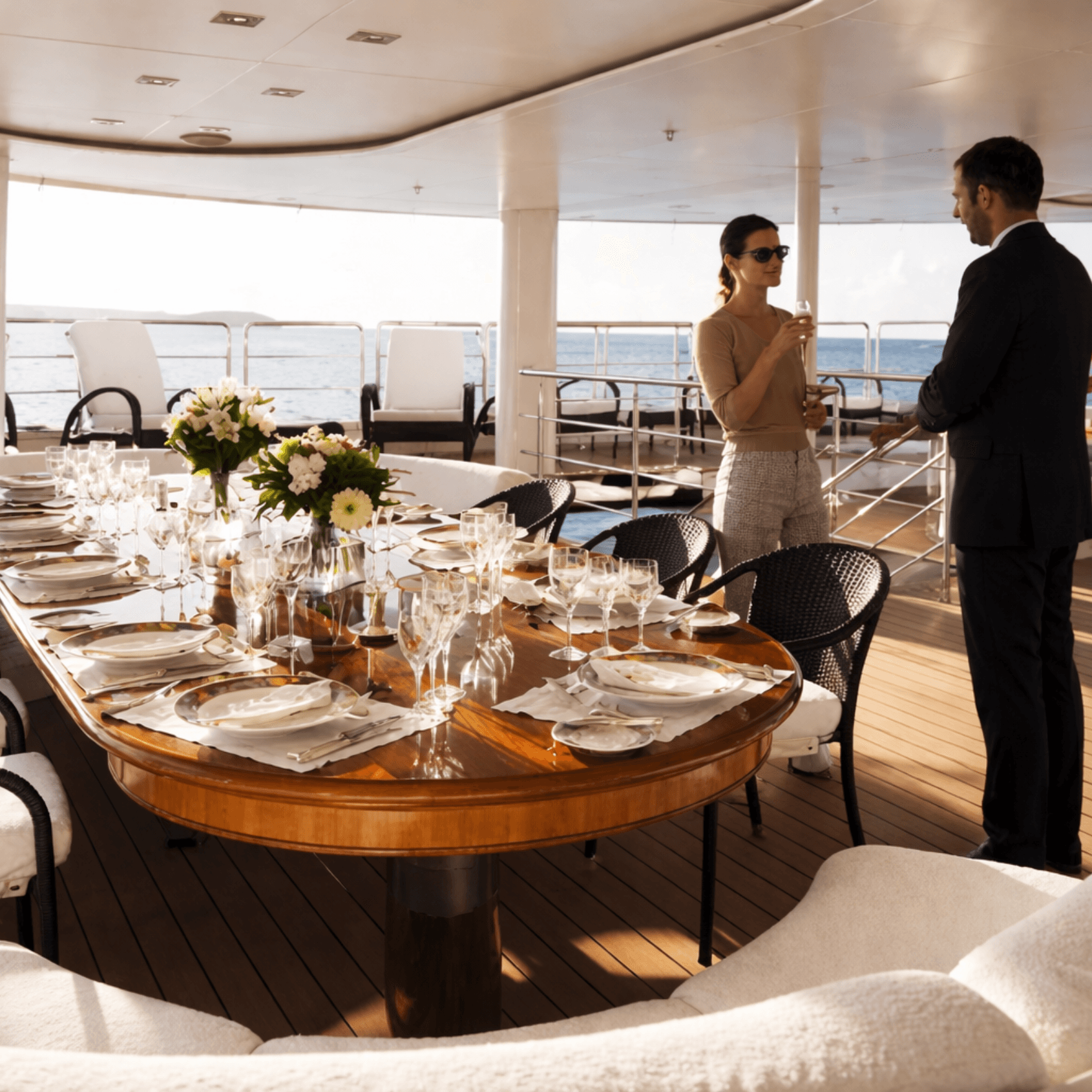 Elegant dinner setup on yacht deck