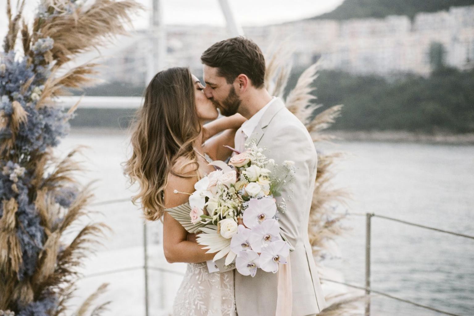 Miami Yacht Wedding Packages — Crown Yachts miami yacht wedding with flowers and decorations on the deck overlooking biscayne bay