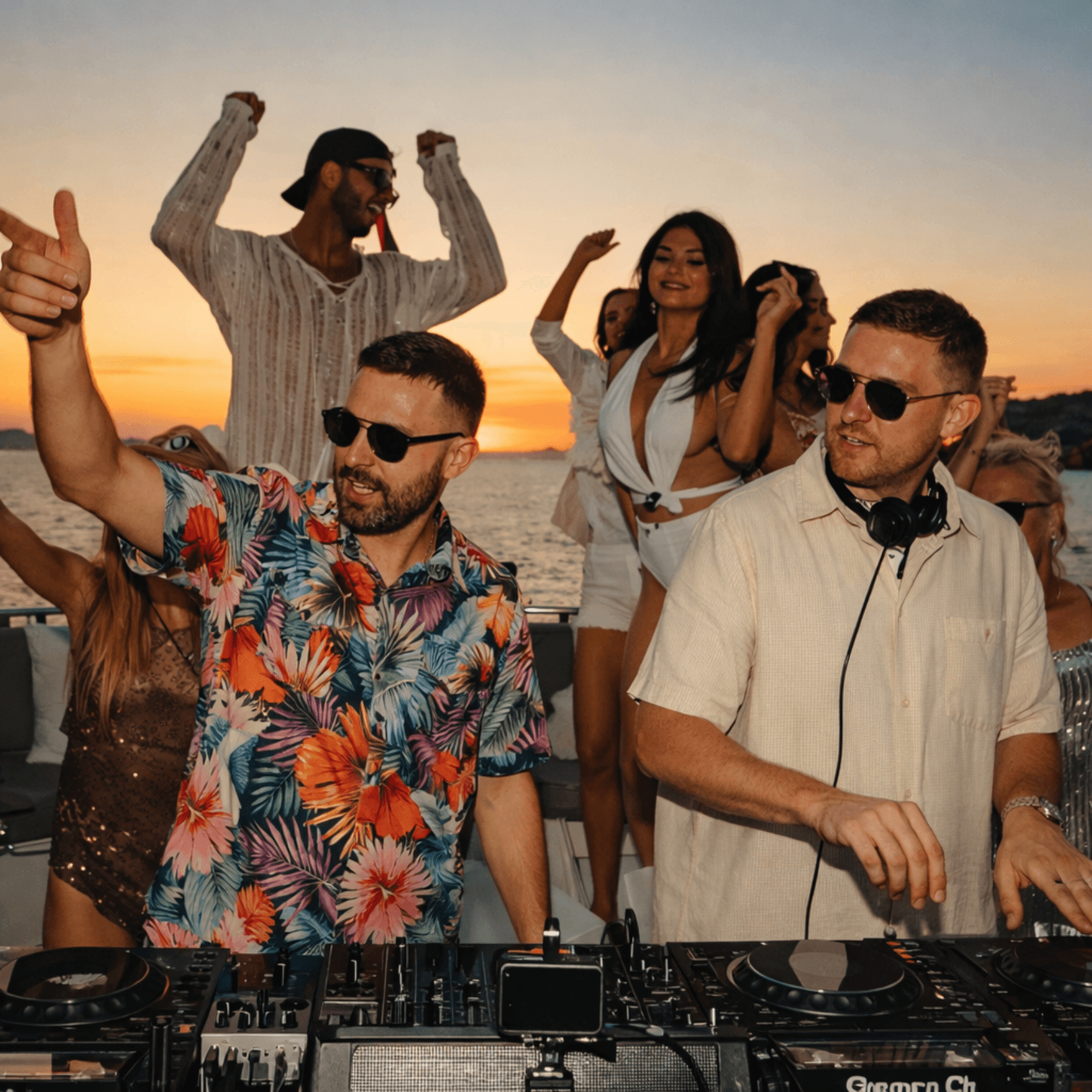 DJ playing music at sunset yacht party in Miami