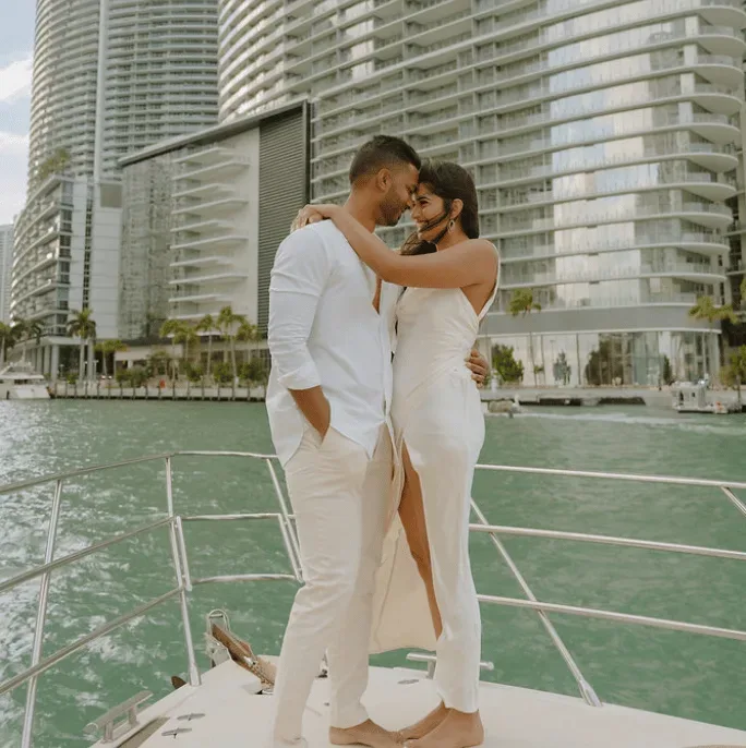 Couple embracing on yacht bow in Miami