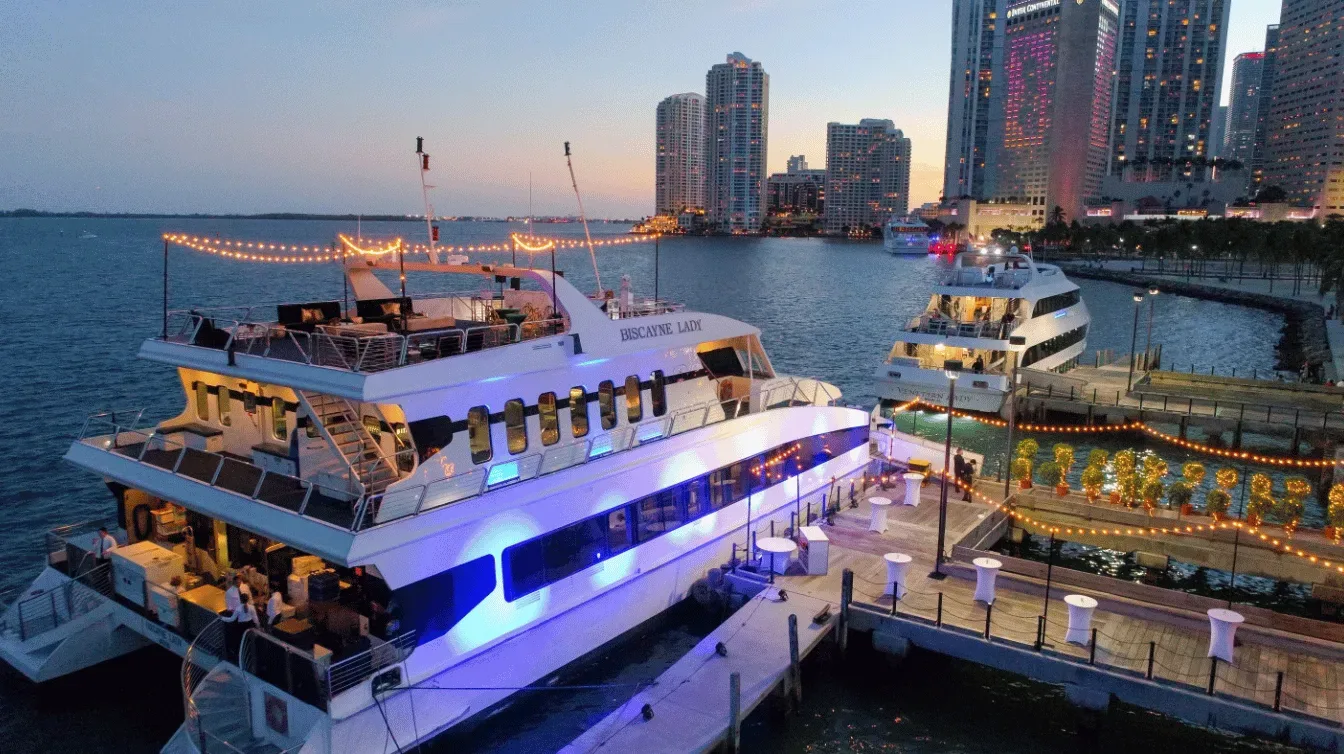 20 person yacht rental Miami, two commercial vessels on Biscayne Bay